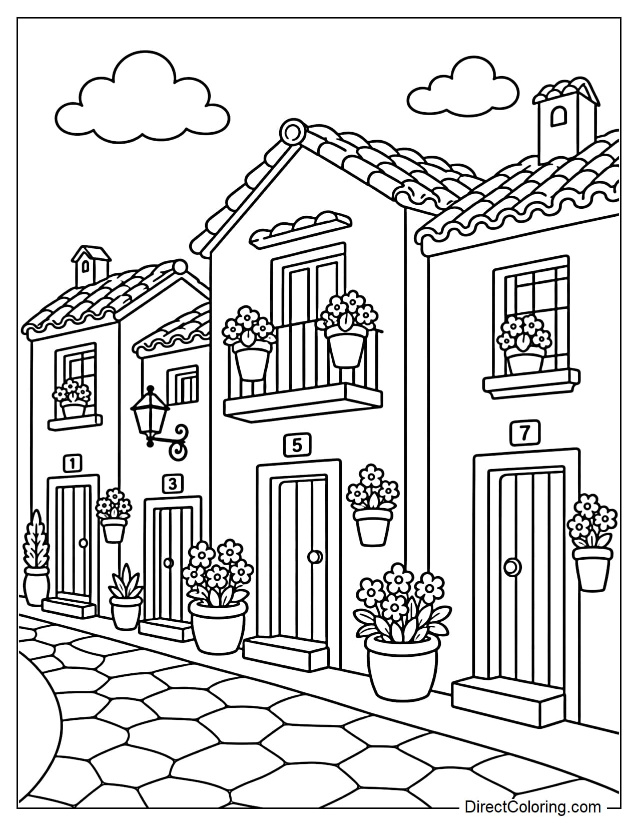 A row of white houses characteristic of Andalusia, with tiled roofs, small windows, and flower pots in front.