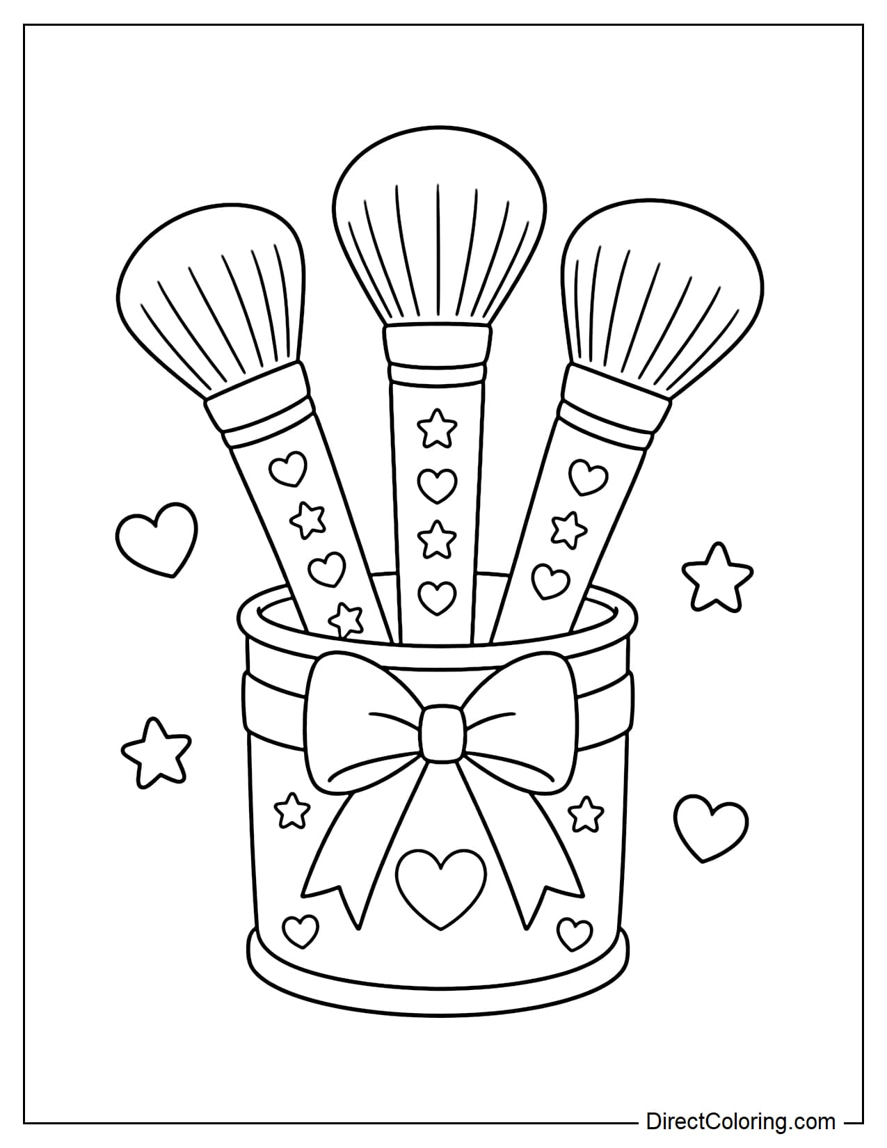 A small cup tied with a bow holding three large round makeup brushes, with heart and star patterns on the handles.