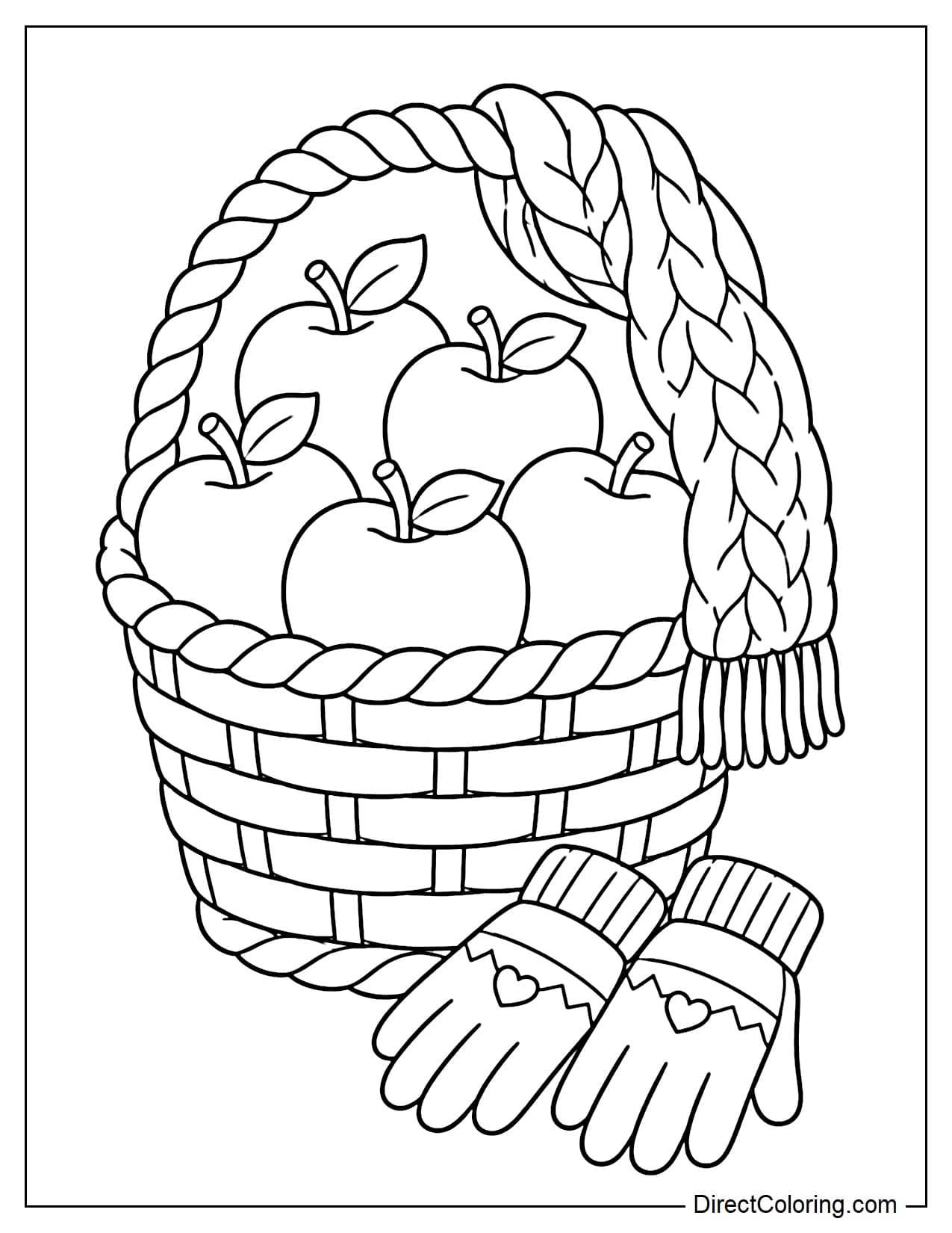 A large woven basket is filled with apples, with a soft knitted scarf loosely wrapped around the handle and a pair of small gloves placed beside it.