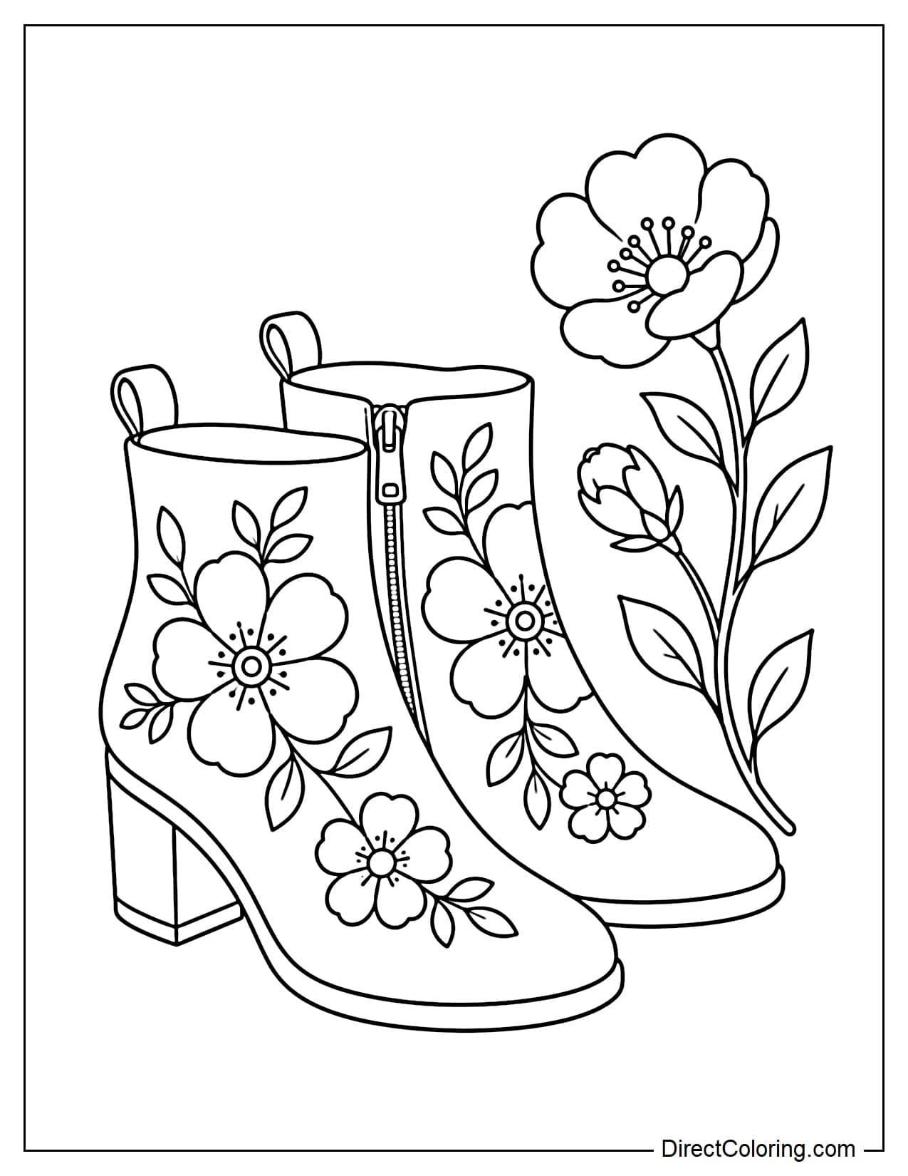 A stylish pair of ankle boots decorated with large floral patterns, accompanied by a blooming flower branch.