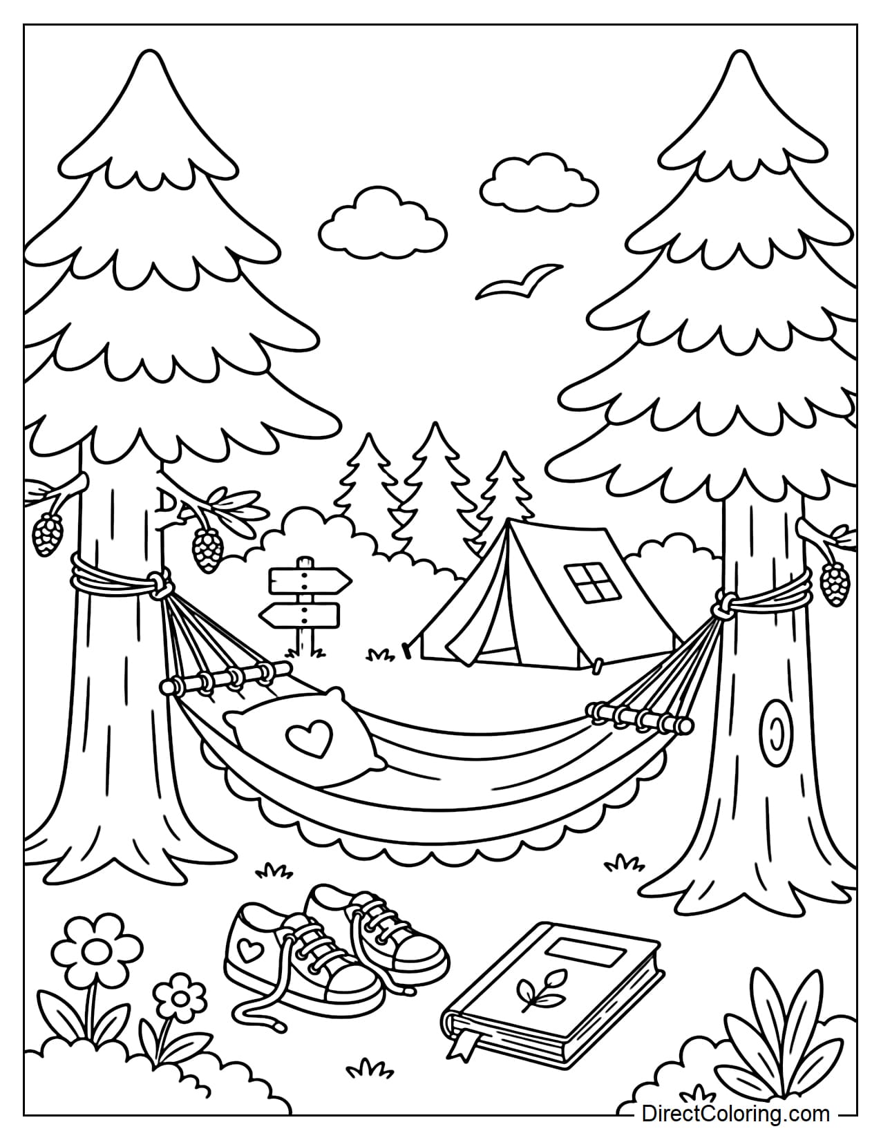 A hammock hanging between two large pine trees in the campsite, with small shoes and a book underneath.